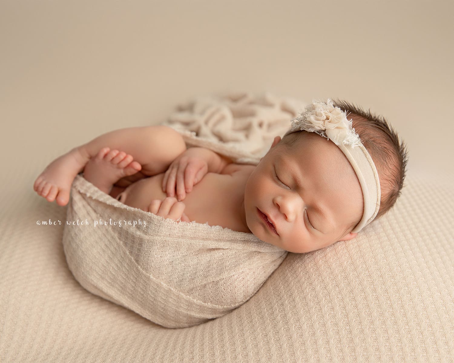 newborn baby girl swaddled in neutal studio session tulsa photography