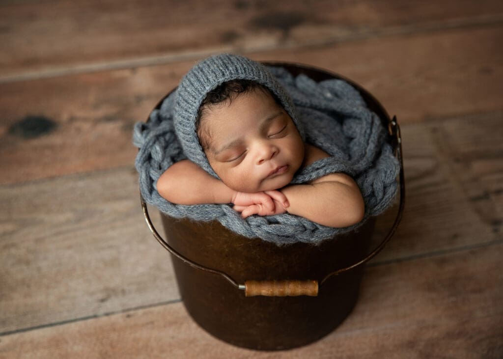 newborn baby in Tulsa studio bucket pose
