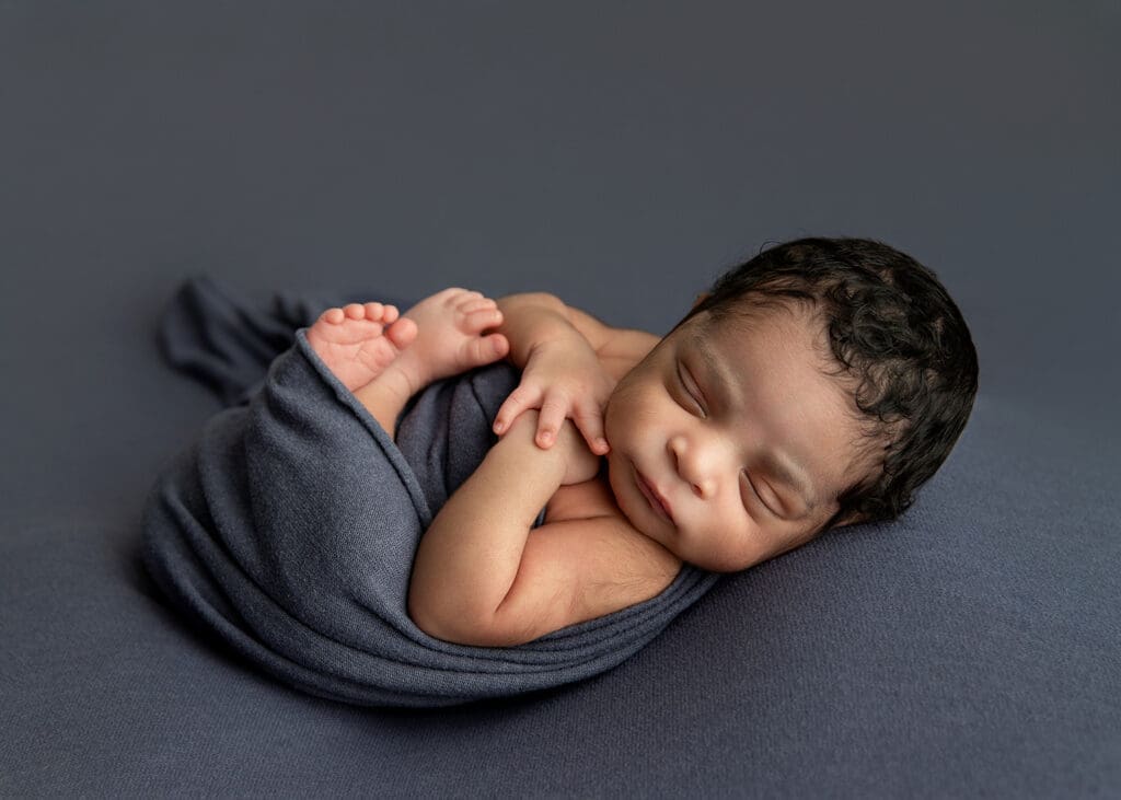 newborn baby boy swaddled in Tulsa newborn mini session